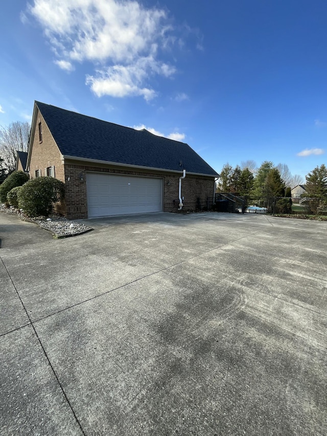 view of property exterior featuring a garage