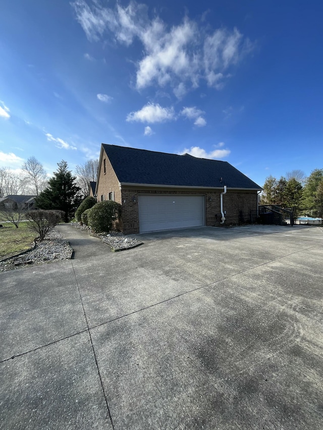 view of side of home with a garage