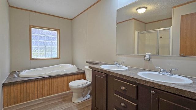 full bathroom with separate shower and tub, crown molding, wood-type flooring, a textured ceiling, and vanity