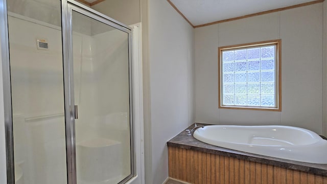 bathroom with crown molding and independent shower and bath