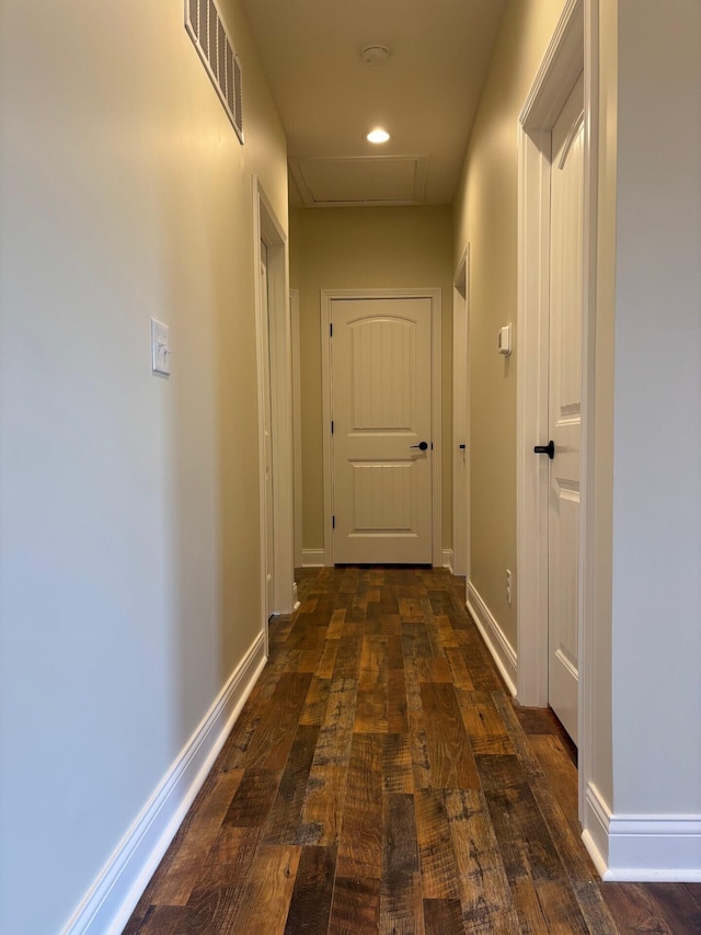 corridor featuring dark wood-type flooring