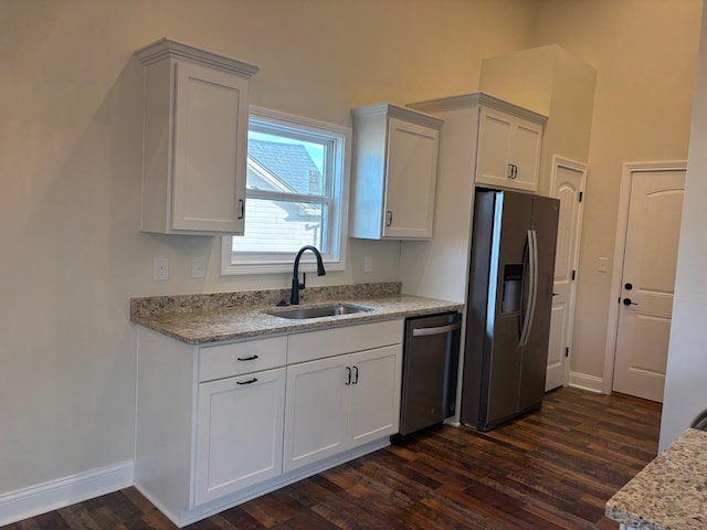 kitchen with dark hardwood / wood-style floors, sink, white cabinetry, and stainless steel appliances