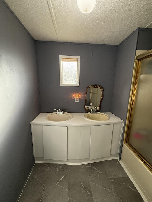 bathroom with vanity and enclosed tub / shower combo