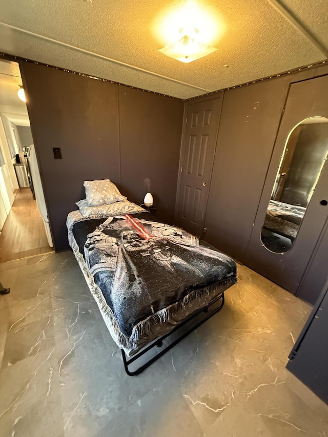 bedroom featuring a textured ceiling