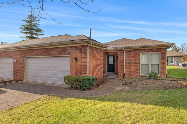 single story home with a garage and a front lawn