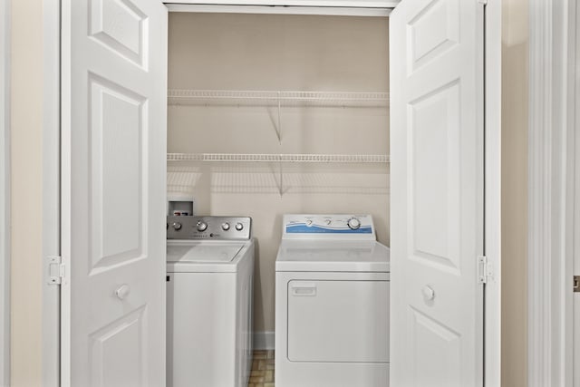 clothes washing area with washer and dryer