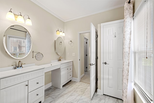 bathroom featuring a wealth of natural light, crown molding, and vanity