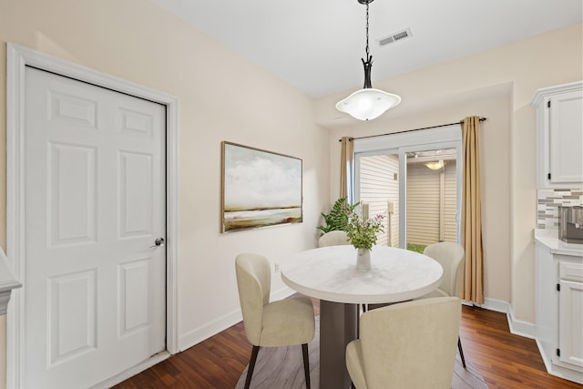 dining area featuring dark hardwood / wood-style floors