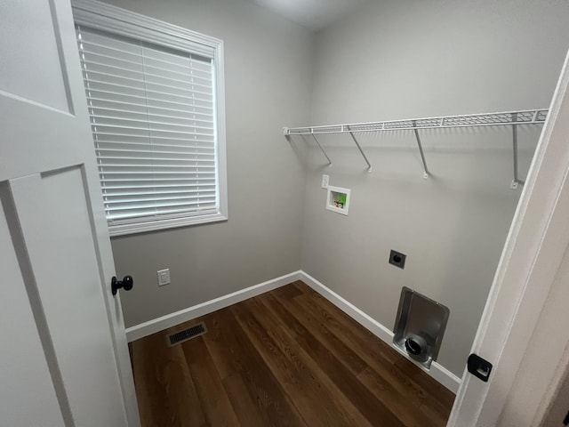 clothes washing area featuring hookup for a washing machine, dark hardwood / wood-style floors, and electric dryer hookup