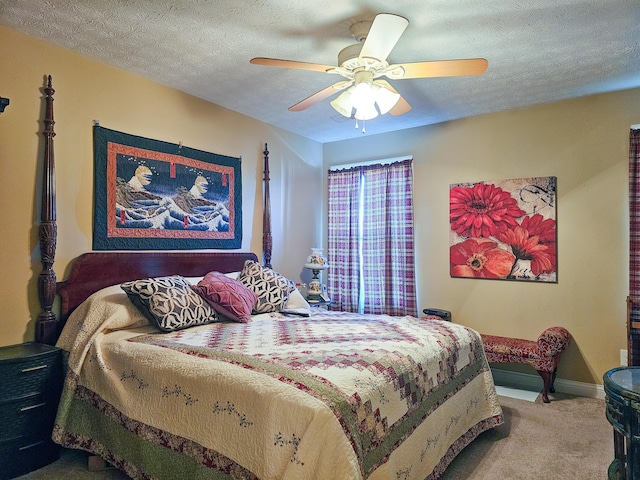 bedroom with carpet flooring, a textured ceiling, and ceiling fan