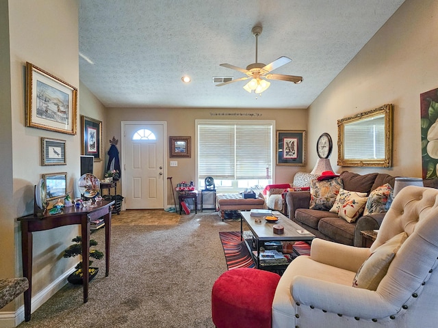 carpeted living room featuring ceiling fan, lofted ceiling, and a textured ceiling