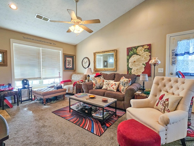 carpeted living room with vaulted ceiling, ceiling fan, and a textured ceiling