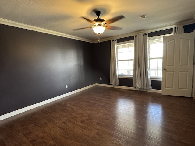 unfurnished room with dark wood-type flooring, ceiling fan, and ornamental molding