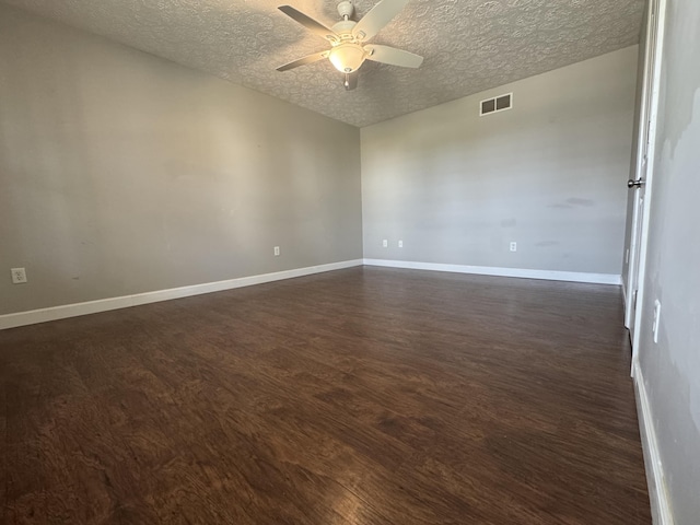 spare room featuring a textured ceiling, ceiling fan, and dark hardwood / wood-style floors