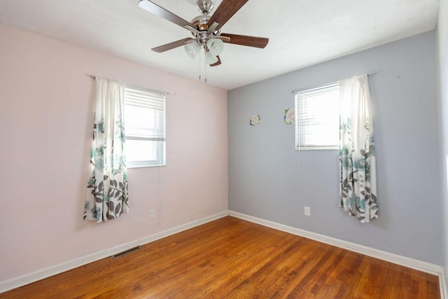 unfurnished room with hardwood / wood-style floors and ceiling fan