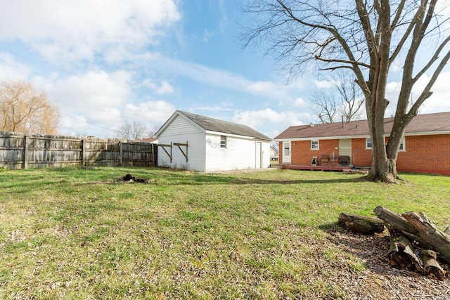 view of yard with an outdoor structure and a deck