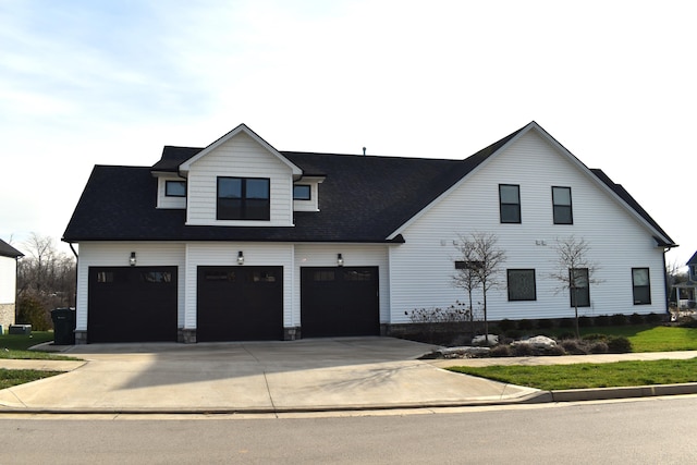 modern inspired farmhouse featuring a garage