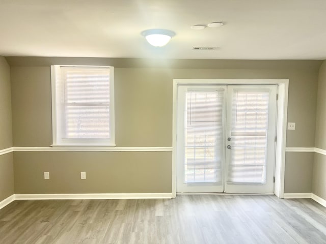 entryway with a wealth of natural light and light wood-type flooring