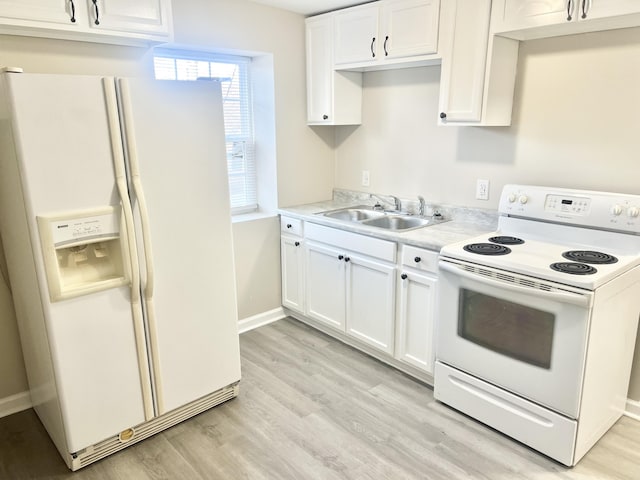 kitchen featuring sink, white cabinets, and white appliances