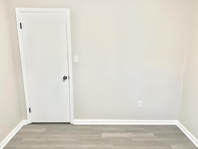 empty room with light hardwood / wood-style floors