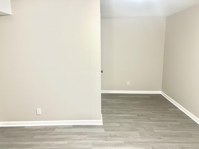 spare room featuring light hardwood / wood-style floors