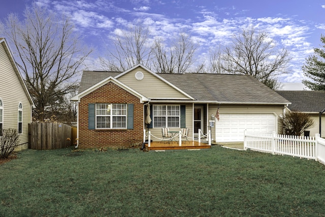 single story home featuring a yard and a garage