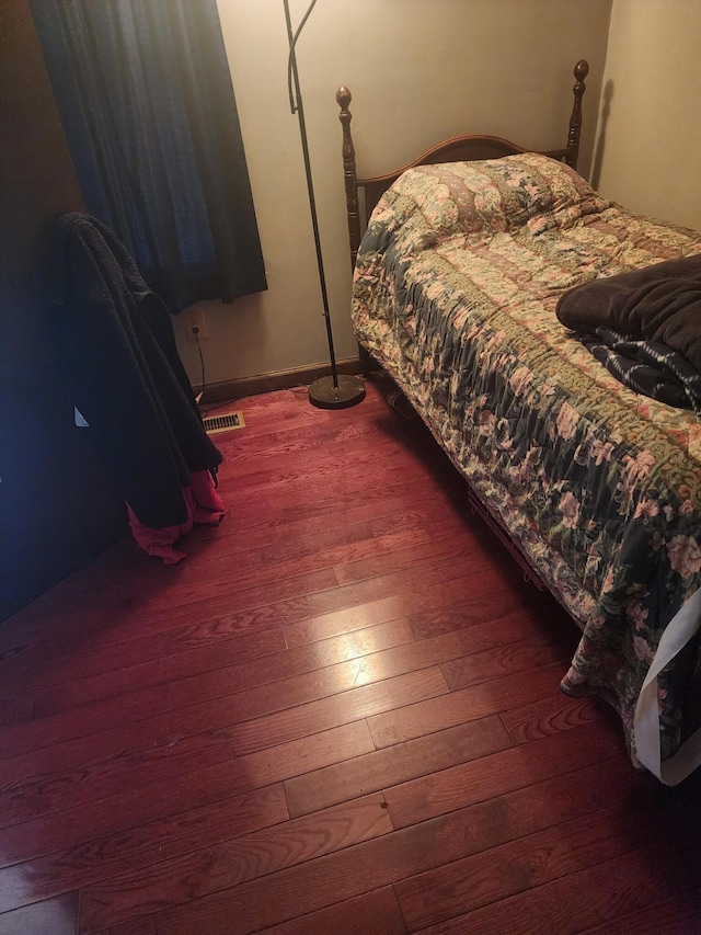 bedroom featuring hardwood / wood-style floors