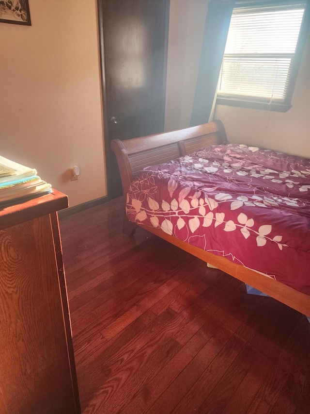 unfurnished bedroom with hardwood / wood-style flooring