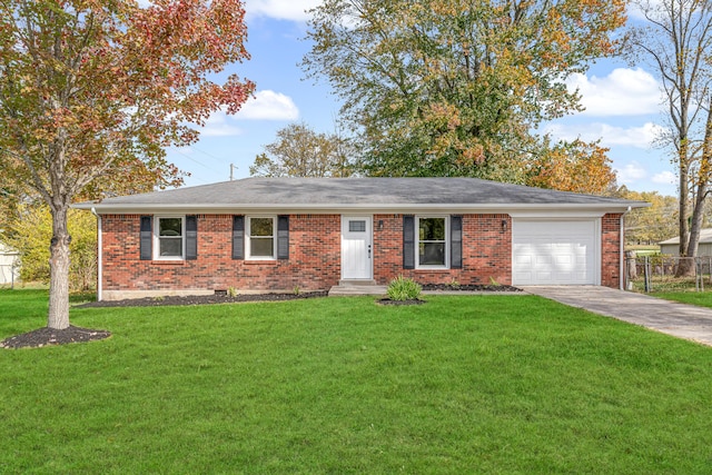 ranch-style house featuring a garage and a front lawn