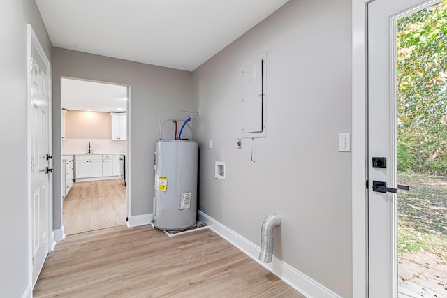 laundry room with washer hookup, electric water heater, electric dryer hookup, sink, and light hardwood / wood-style floors