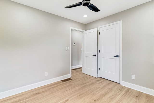 unfurnished bedroom featuring ceiling fan and light hardwood / wood-style floors