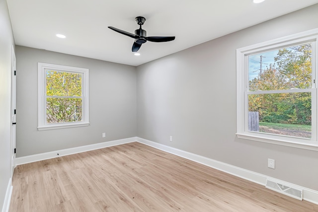 spare room featuring ceiling fan and light hardwood / wood-style flooring