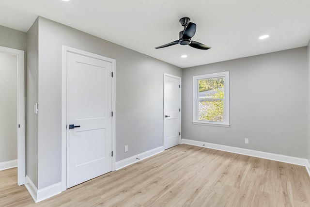 unfurnished bedroom featuring ceiling fan and light hardwood / wood-style floors