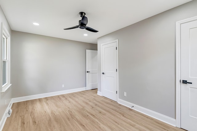 unfurnished bedroom featuring light hardwood / wood-style flooring and ceiling fan