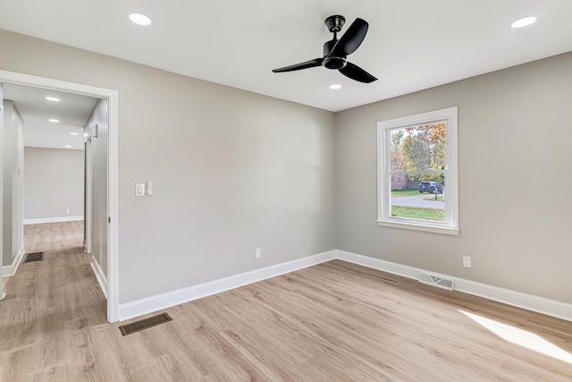 unfurnished room with ceiling fan and light wood-type flooring