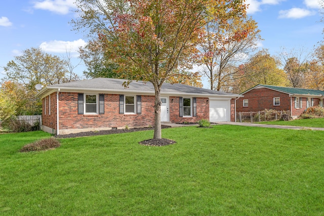 ranch-style house with a garage and a front yard