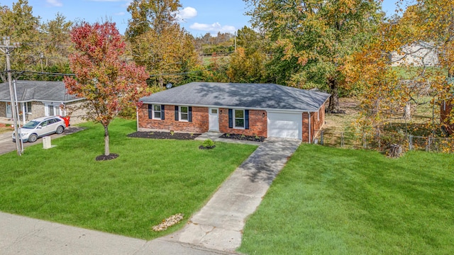 view of front of house featuring a garage and a front yard