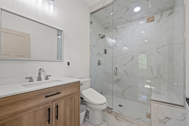 bathroom featuring vanity, toilet, and a shower with door