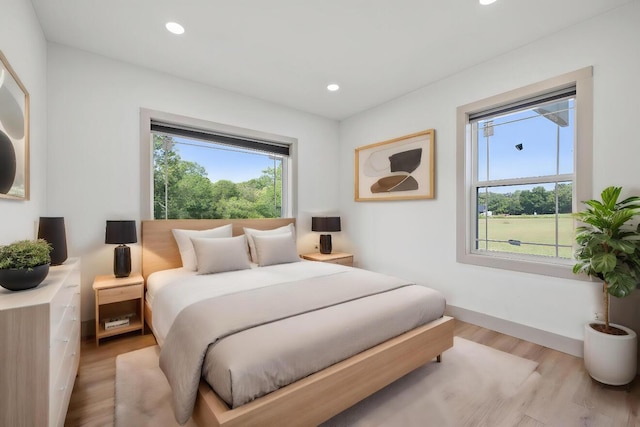 bedroom with light wood-type flooring