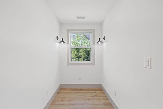 spare room featuring light hardwood / wood-style floors