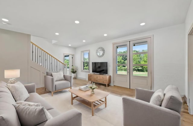 living room with light hardwood / wood-style flooring