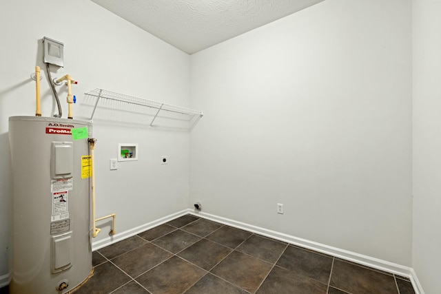 clothes washing area with hookup for an electric dryer, washer hookup, electric water heater, and a textured ceiling