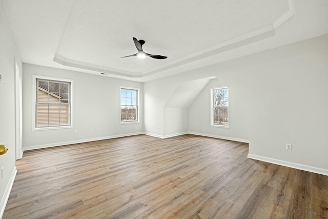 bonus room featuring a textured ceiling, light wood-type flooring, and ceiling fan