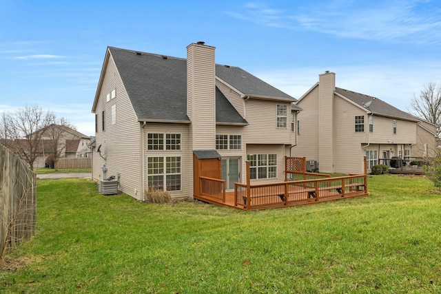 back of house with a wooden deck, a yard, and central AC unit