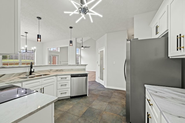 kitchen with white cabinets, ceiling fan with notable chandelier, sink, and stainless steel appliances