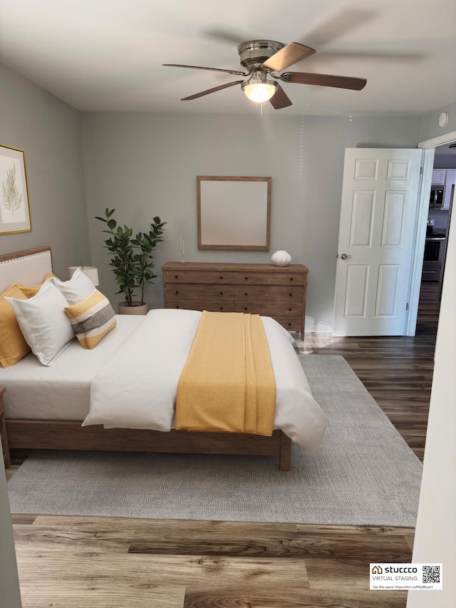 bedroom featuring ceiling fan and hardwood / wood-style flooring