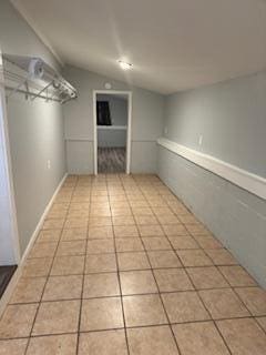 basement featuring light tile patterned floors