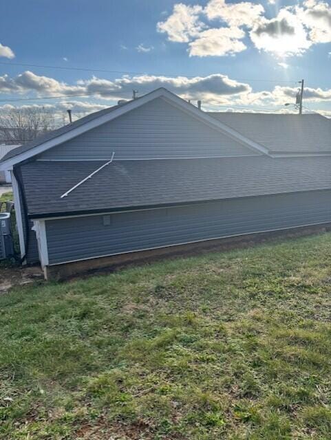 view of property exterior featuring a lawn