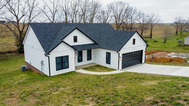 modern inspired farmhouse featuring central AC, a front yard, and a garage