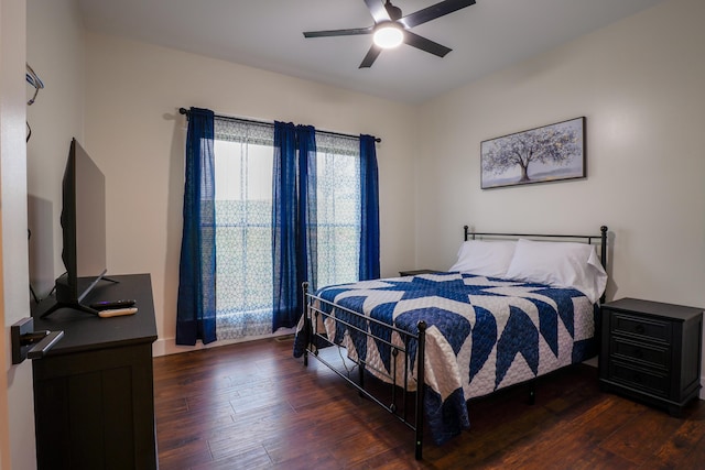 bedroom featuring ceiling fan and dark wood-type flooring